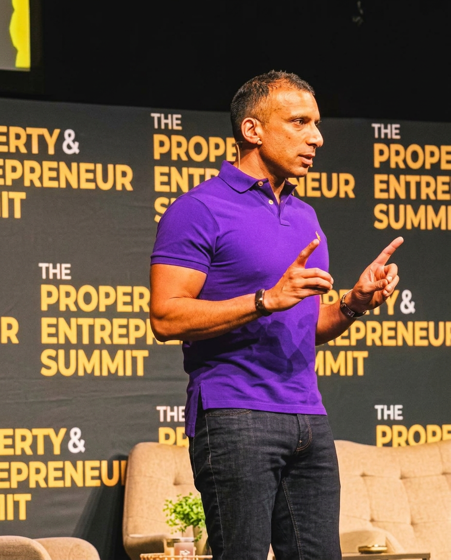 Dillon Dhanecha, founder of Housing Pledge, speaking on stage